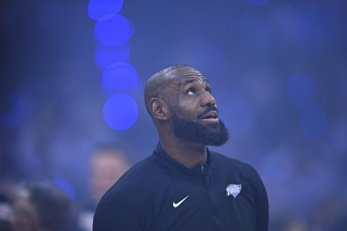 LeBron James (23) sends up a prayer before his first tennis match. Mandatory Credit: David Richard-Imagn Images