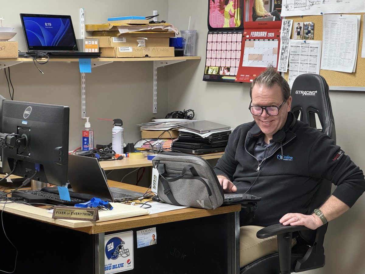 Jeff Kay helping maintain cybersecurity in his office at the GOA Upper School, 