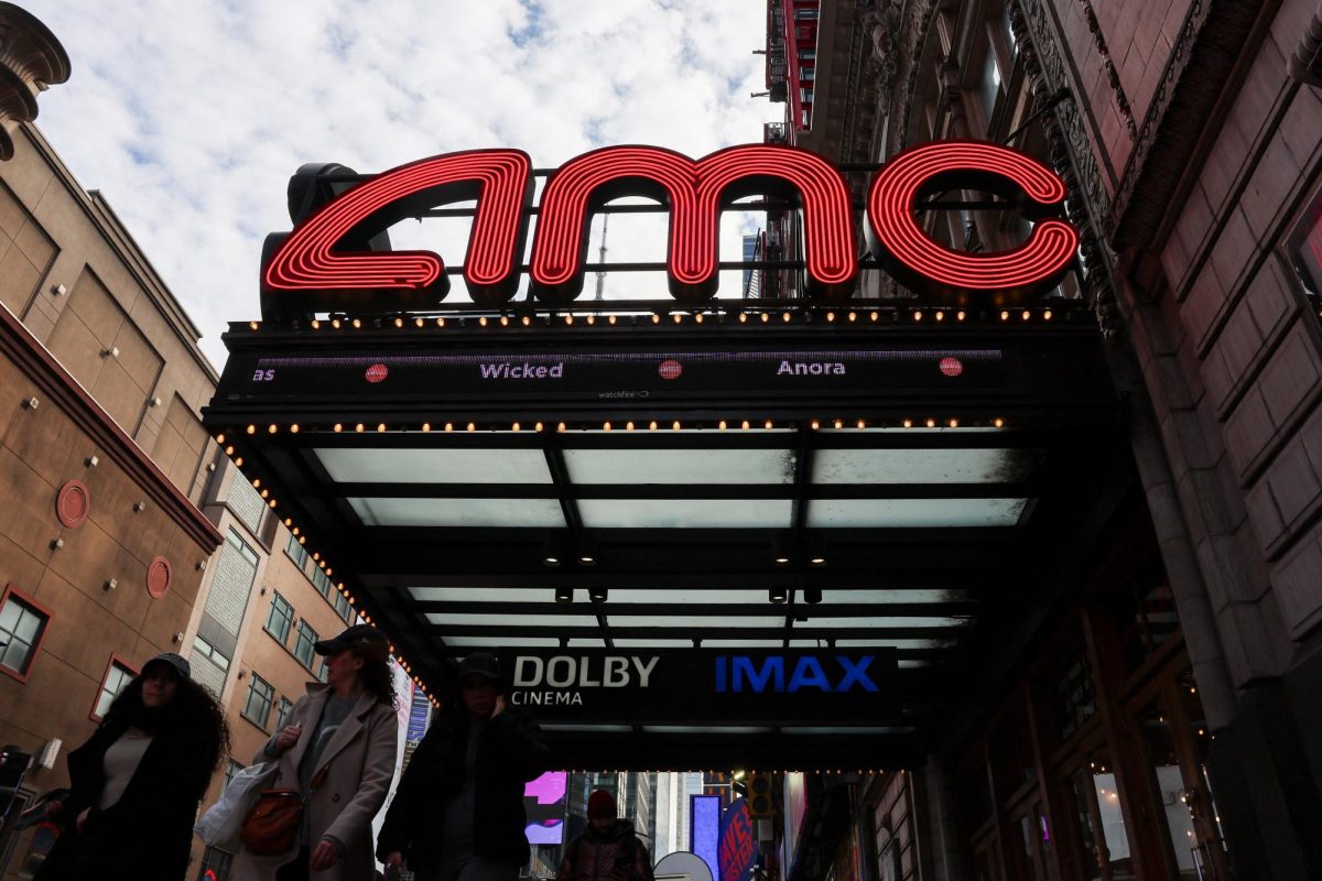 People walk past an AMC theatre in Manhattan in New York City, U.S., February 25, 2025. REUTERS/Jeenah Moon