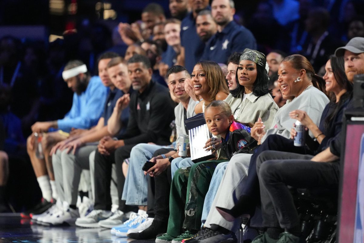 Feb 15, 2026; Inglewood, California, USA; From left: Victoria Monet, Teyana Taylor, Queen Latifah, Meghan Duchess of Sussex and Prince Harry Duke of Sussex watch in game two during the 75th NBA All Star Game at Intuit Dome. Mandatory Credit: Kirby Lee-Imagn Images
