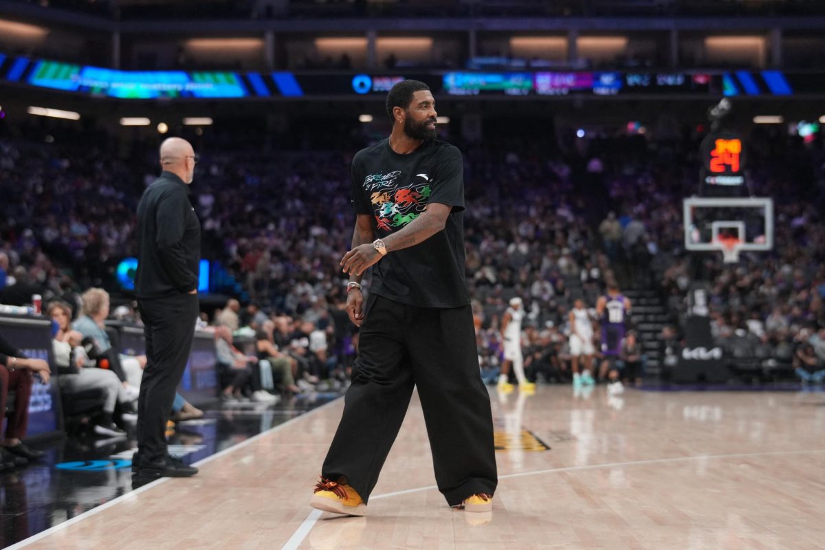 Jan 6, 2026; Sacramento, California, USA; Dallas Mavericks guard Kyrie Irving stands on the court during a timeout against the Sacramento Kings in the second quarter at the Golden 1 Center. Mandatory Credit: Cary Edmondson-Imagn Images