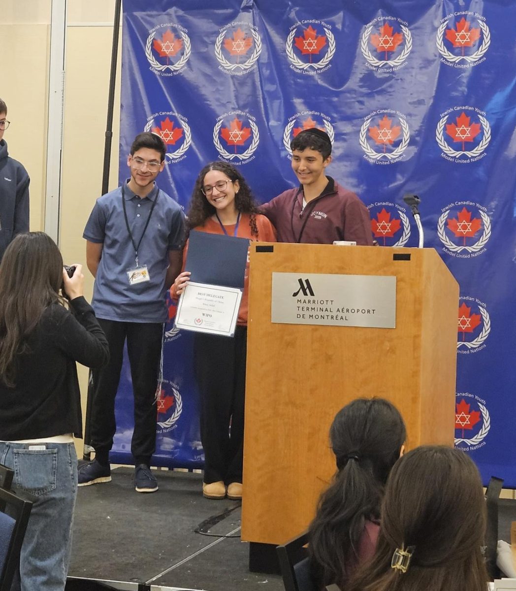 GOA Junior Alma Adiel with her committee chairs as she receives her Best Delegate award at JCYMUN in Montreal, Canada, March 2026.