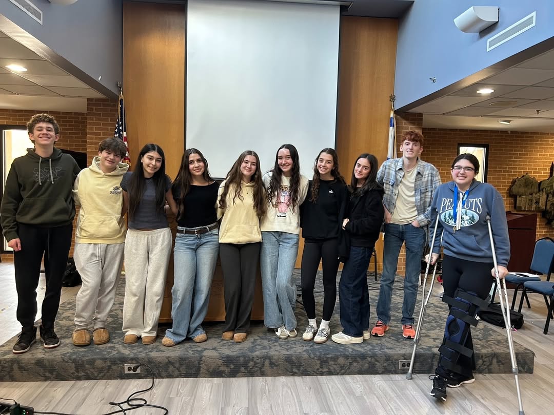 Left to Right: Joseph Sherman '28, Salomon Messulan '28, Anabelle Silva '28, Annabella de Picciotto '29, Tamar Ashkenazi '29, Layla Sharret '27, Violet Berman '27, Talia Herbert '27, Seth Perlstein '27, and Emily Himber '28 pose for a photo after presenting their their speeches the Student Council Town Hall on March 4th, 2026.